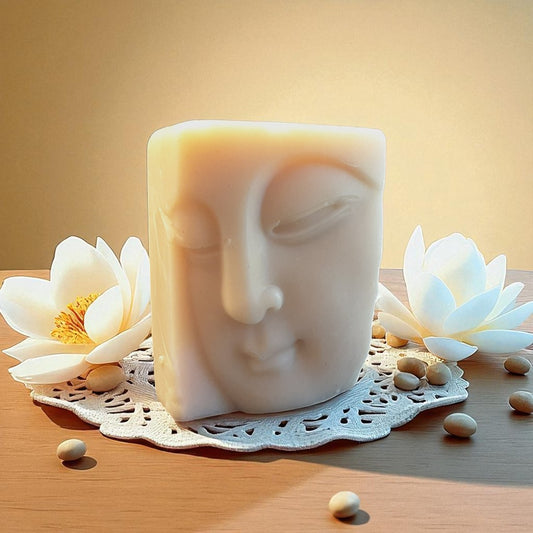 Buddha soap with lotus flowers and seeds on a wooden surface