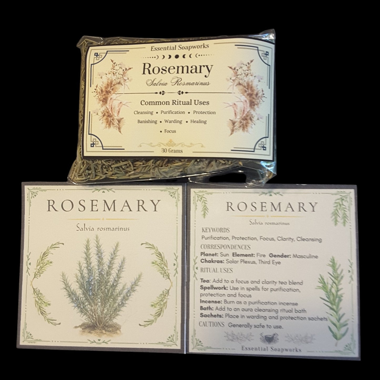 Two square cards and a clear plastic bag containing dried rosemary bundles for a ritual cleansing set, labeled 'Rosemary' by Essential Soapworks, displayed on a black background.