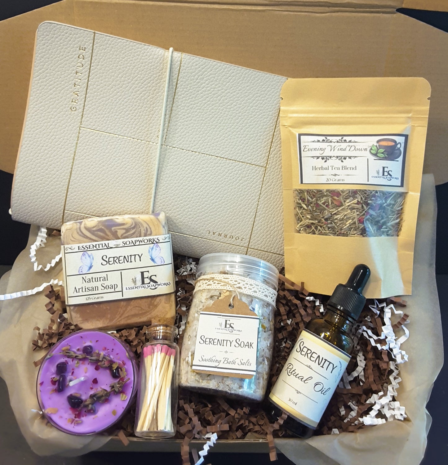 Evening Wind Down Ritual Kit featuring soap, tea, candle, essential oil blend, journal and bath salts