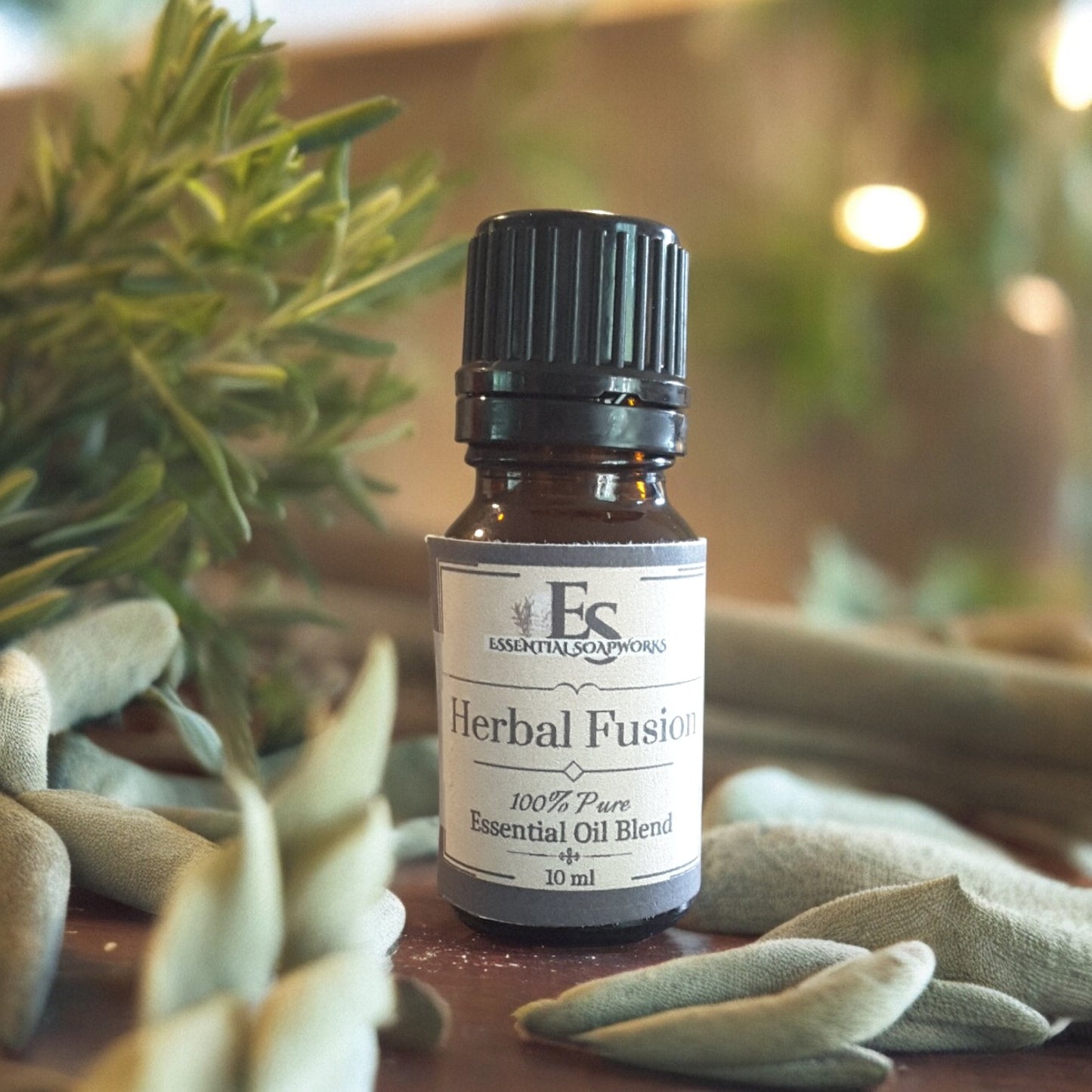 Bottle of Herbal Fusion essential oil diffuser blend with herbs on a wooden surface