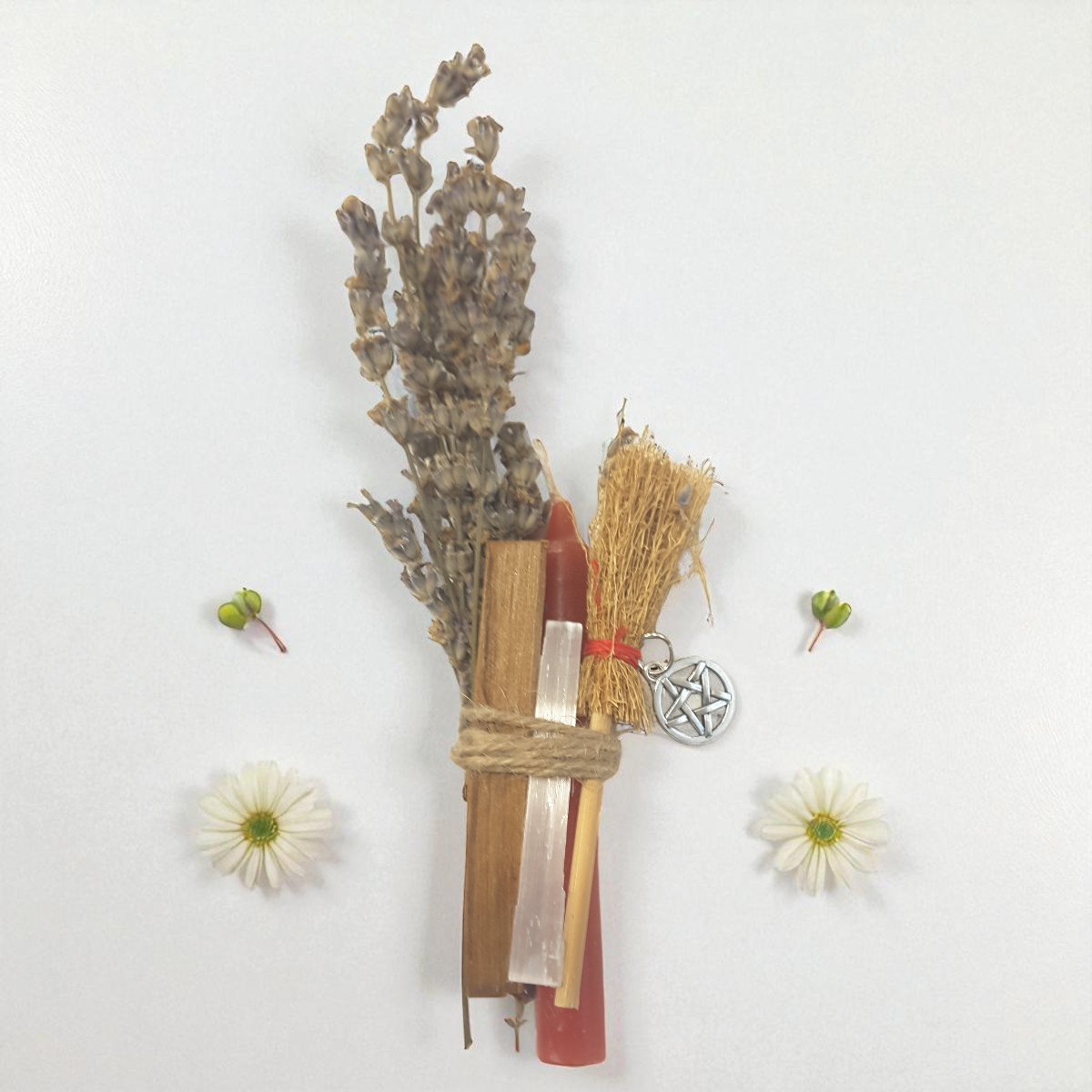 Herbal bundle with pentacle charm on a white background