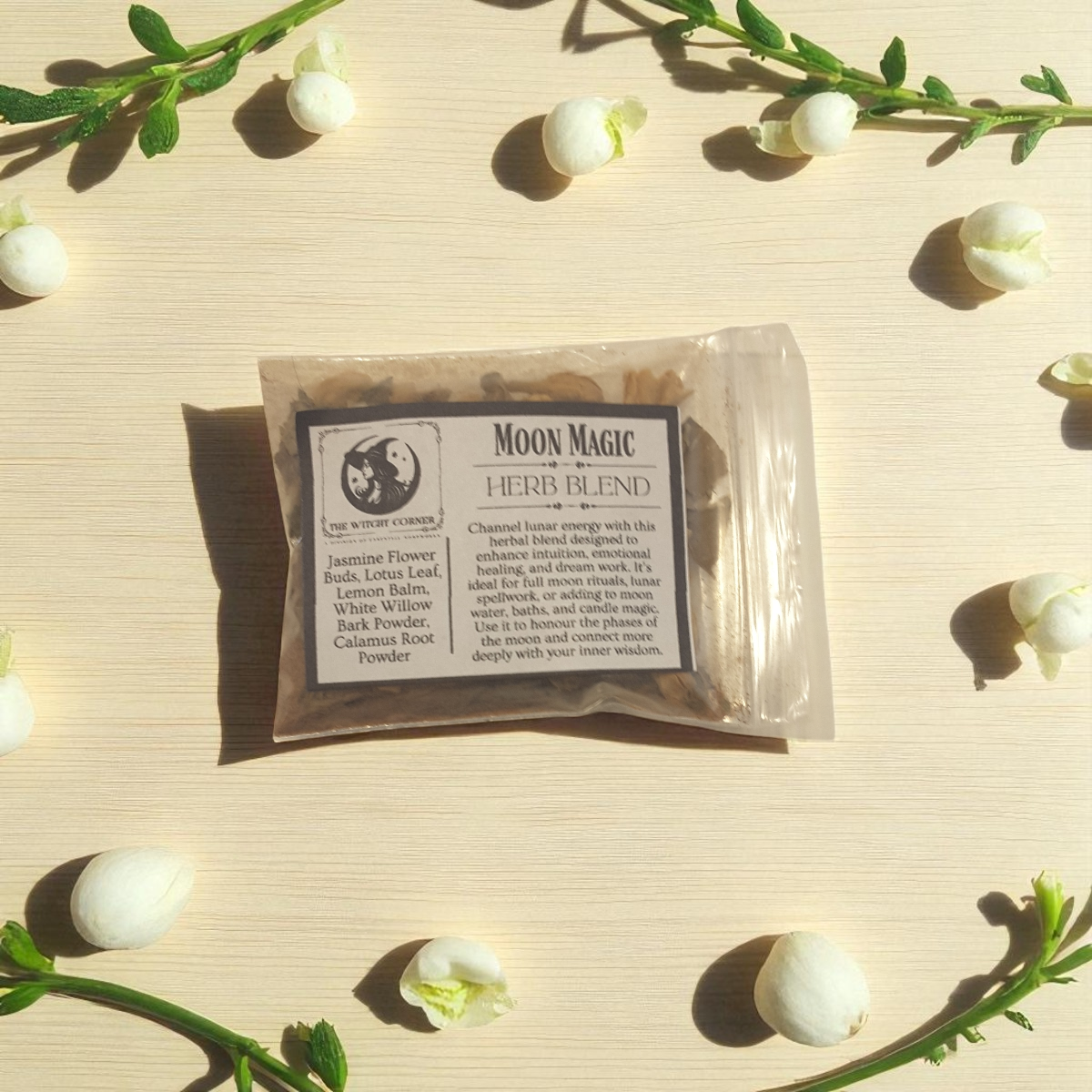 Moon Magic Herb Blend package on a light background with decorative elements