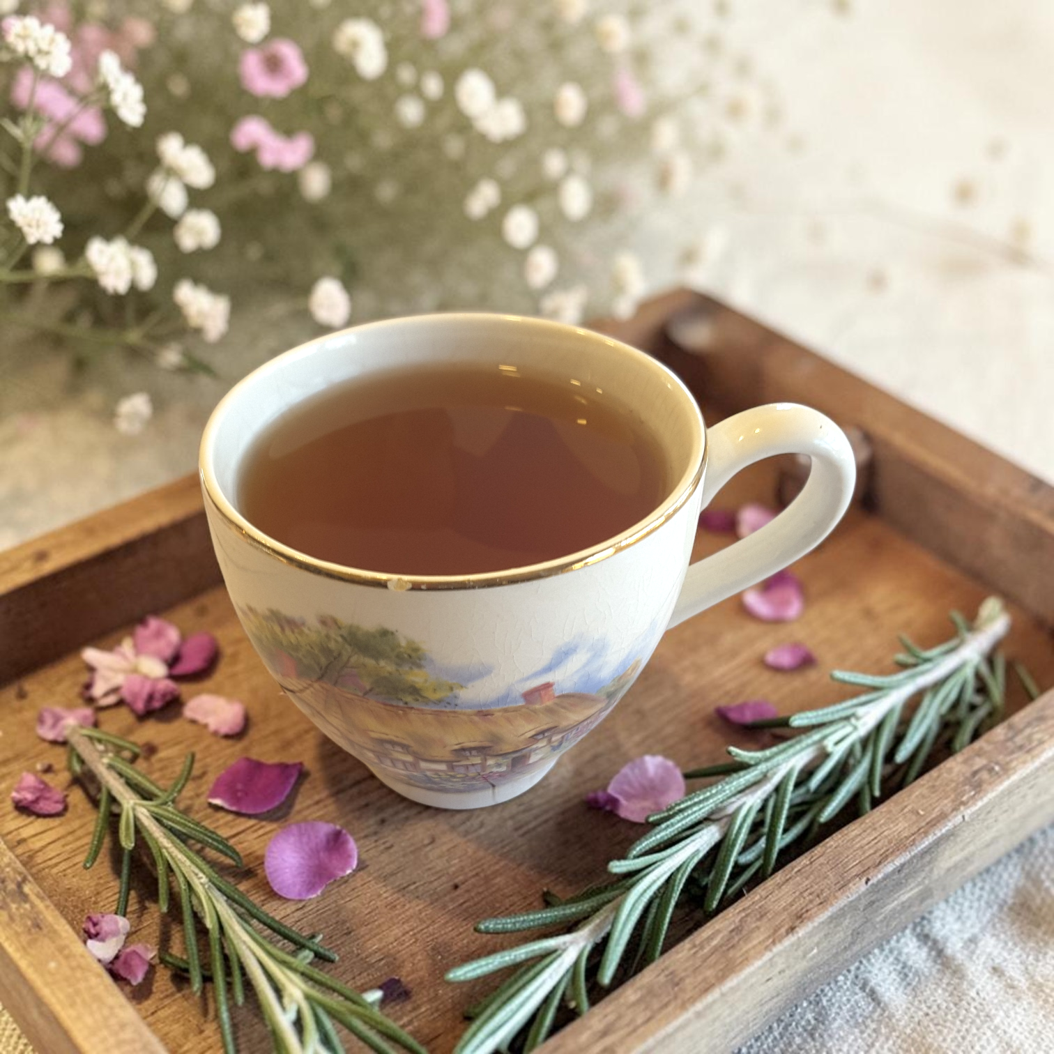 focus tea blend with flowers and greenery on a wooden tray