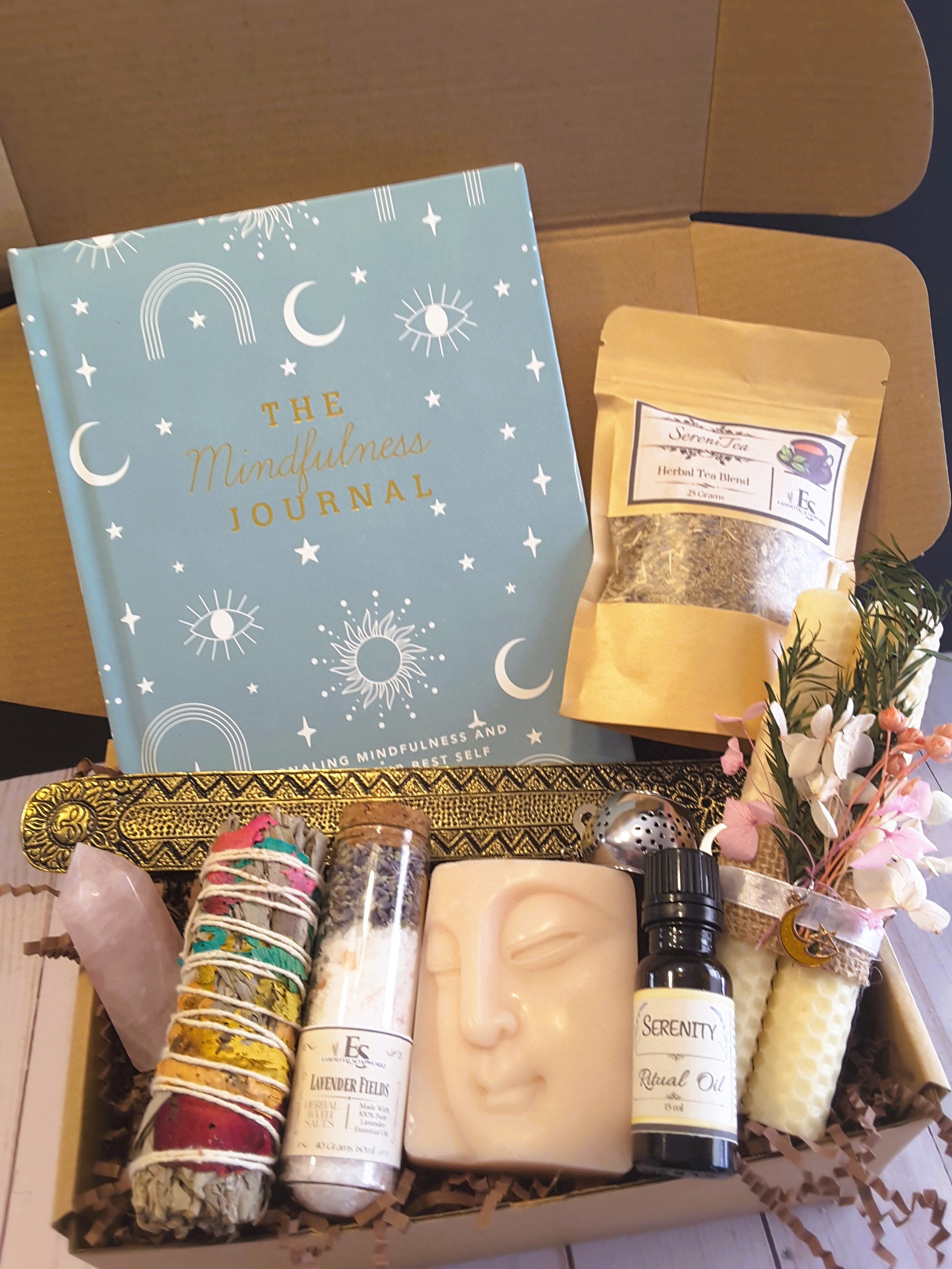 Spiritual Wellness Ritual kit with mindfulness journal, tea, and various wellness items.