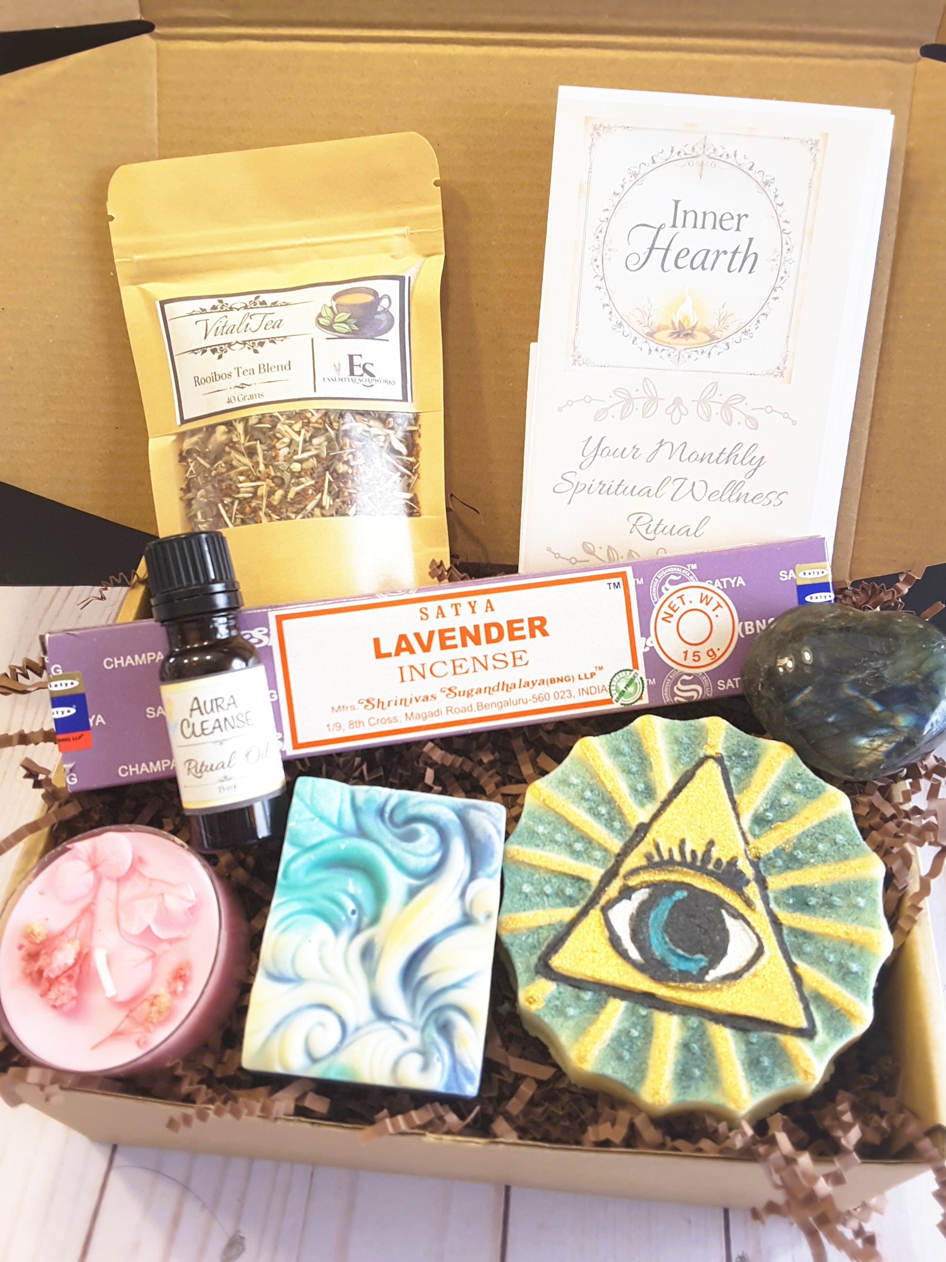 Spiritual Wellness Ritual kit containing various items including ritual oil, soap, and incense on a wooden surface.