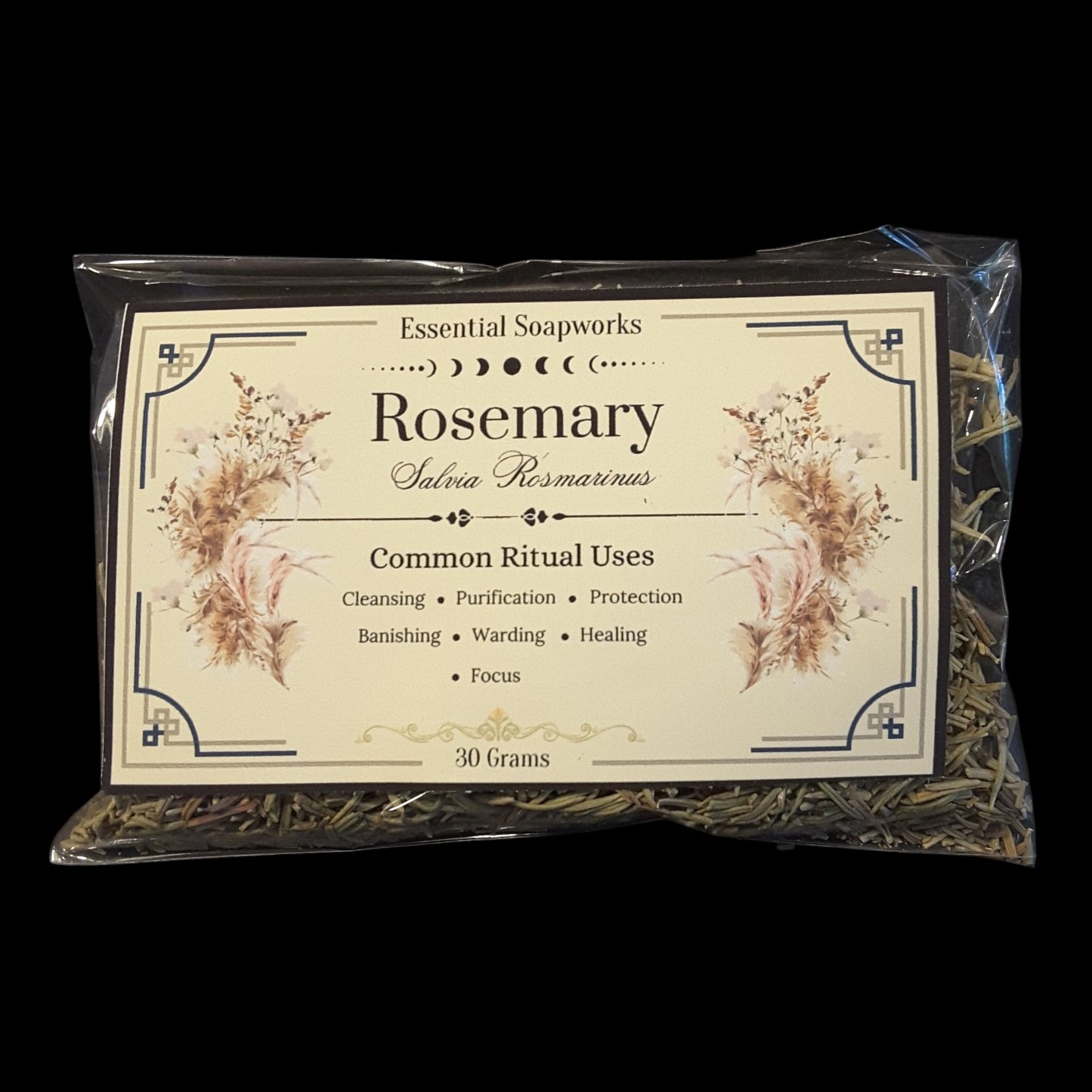 A package of Rosemary containing 30 grams. The rosemary is visible through a clear plastic bag with a decorative cream-colored label featuring botanical illustrations, set against a solid black background.