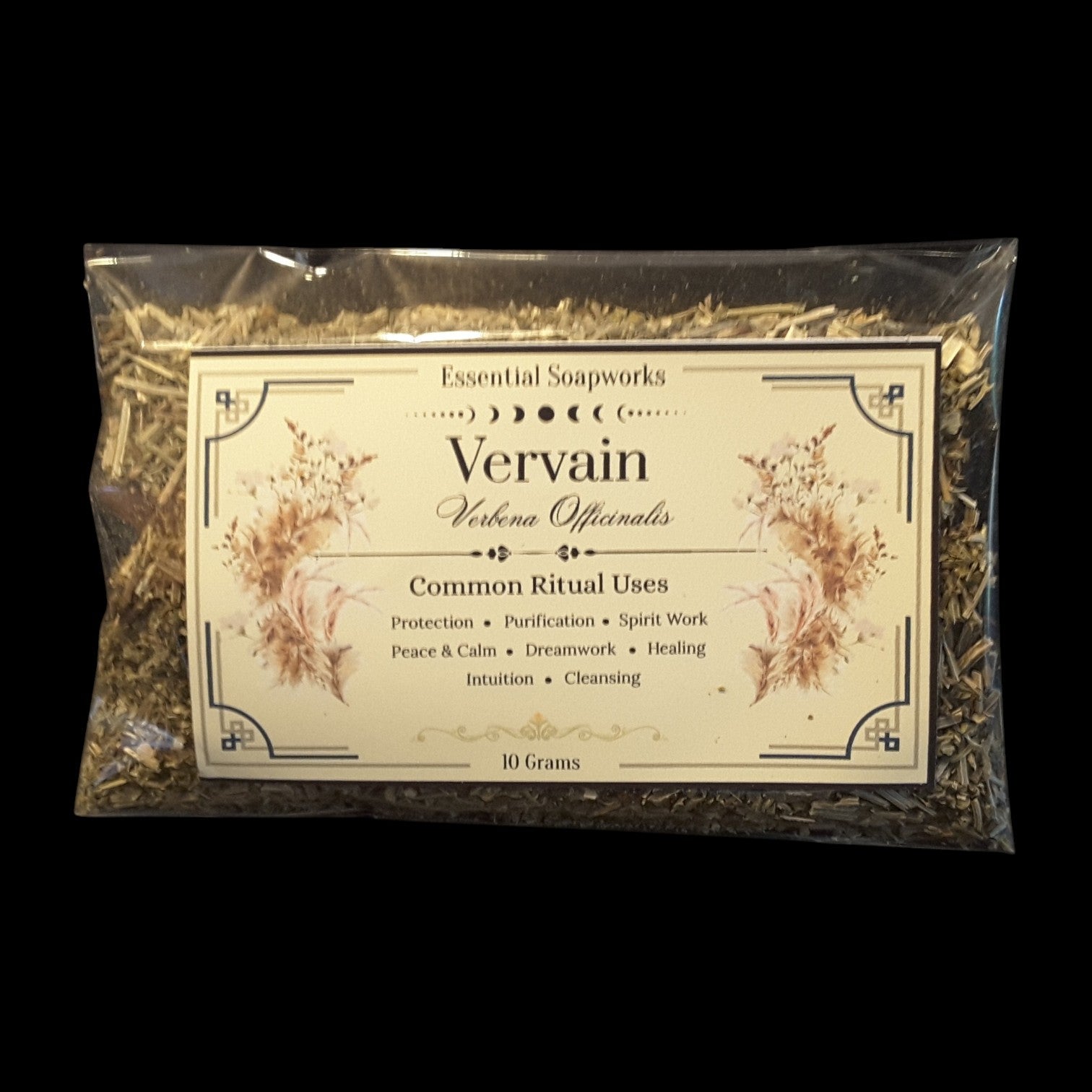 A 10 gram package of 'Vervain' herb for witchcraft, sealed in a clear plastic bag with a cream-colored label, set against a solid black background.