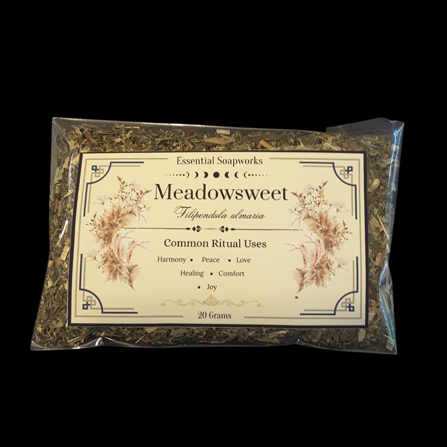 A clear plastic bag containing dried meadowsweet with a large cream-colored label. The label reads 'Essential Soapworks Meadowsweet' and shows botanical illustrations, set against a solid black background.