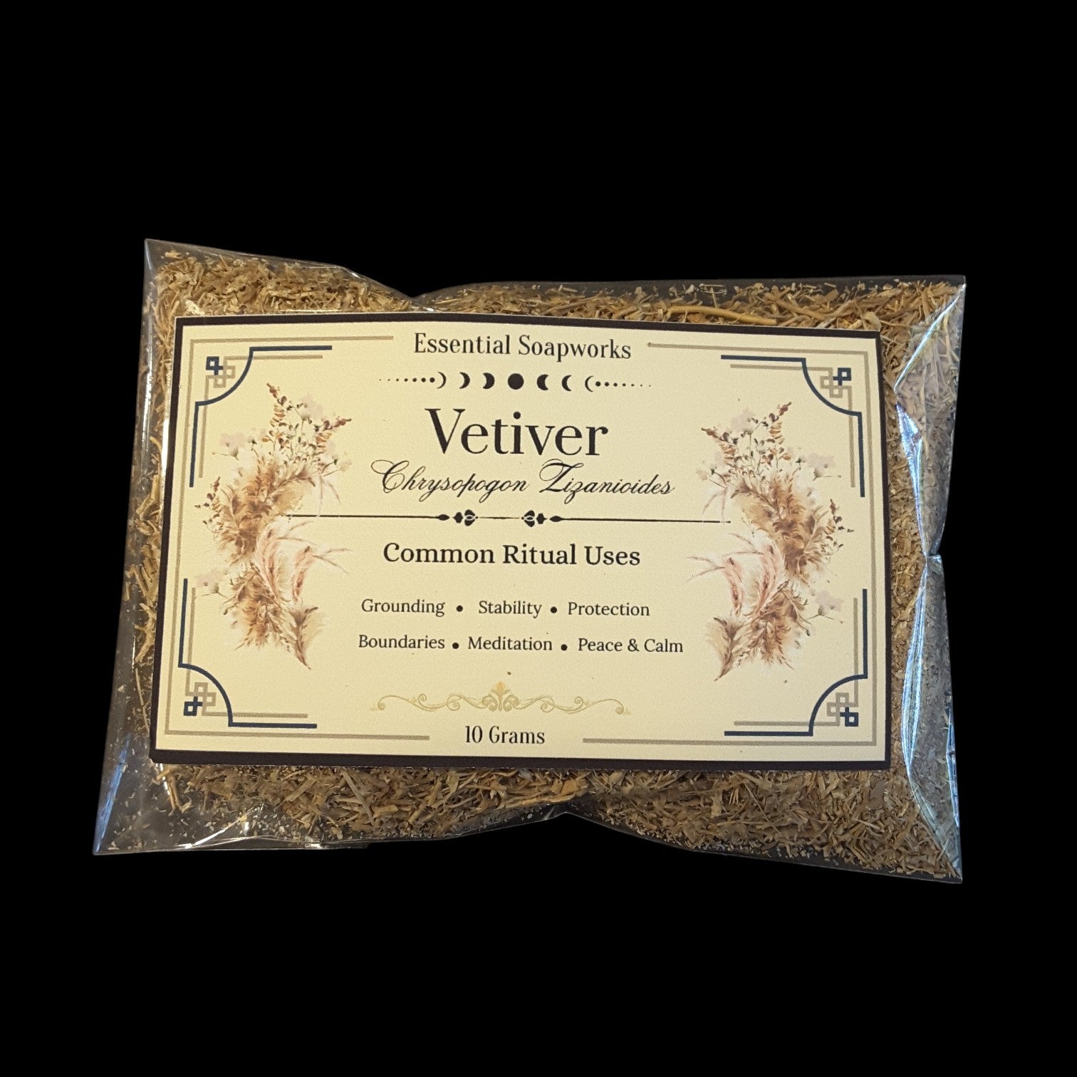 A 10g clear plastic bag of Vetiver, featuring a cream-colored label with botanical illustrations, set against a solid black background.