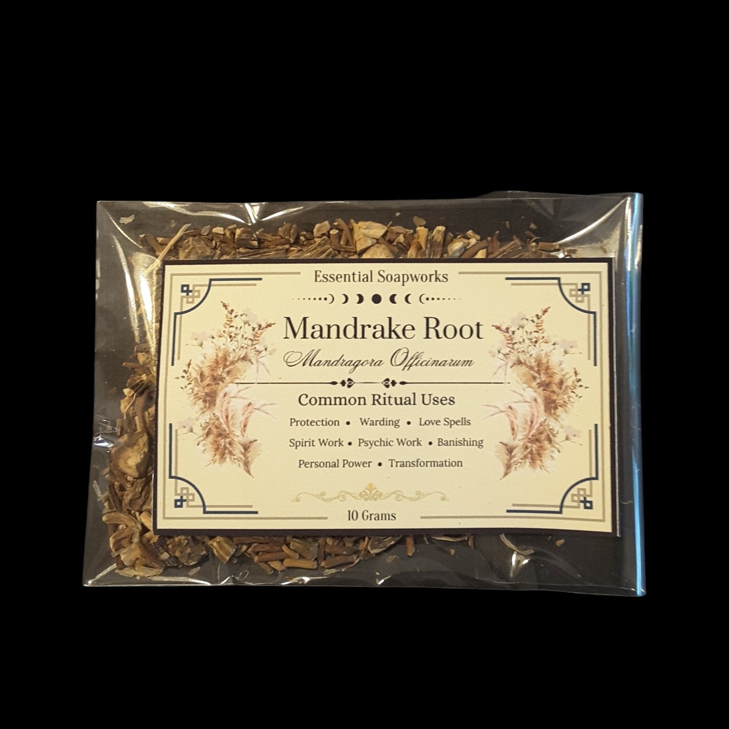 A 10 gram package of Mandrake Root dried botanicals in a clear plastic bag with a decorative cream label, set against a solid black background.
