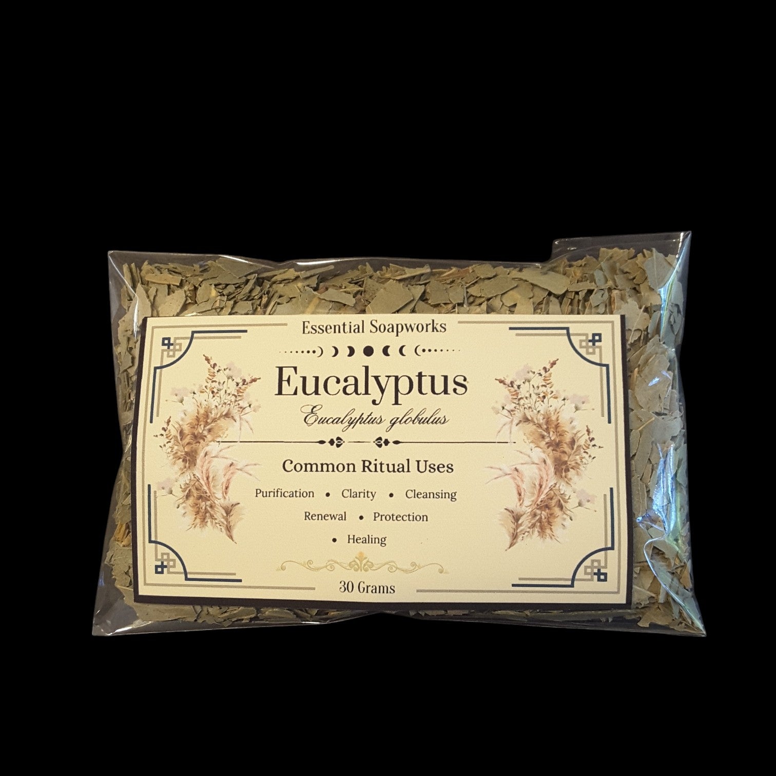 A 30g package of Eucalyptus dried leaves from Essential Soapworks, sealed in a clear plastic bag with a cream-colored label featuring botanical illustrations.