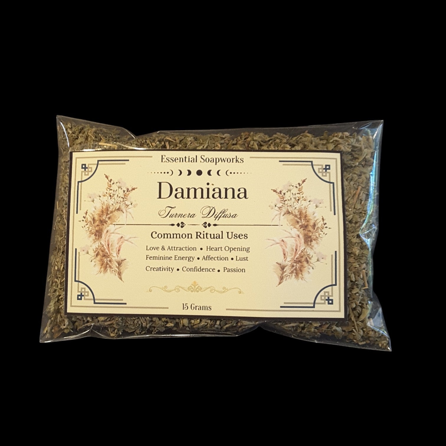 A 15g clear plastic bag of Damiana by Essential Soapworks, featuring a cream-colored label with floral illustrations, set against a solid black background