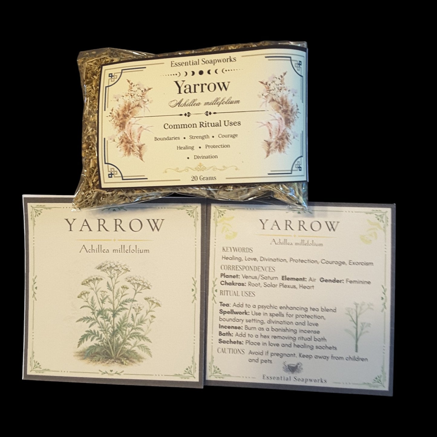 Three Yarrow Essential Soapworks products arranged on a black background: a small wrapped bundle at the top and two flat cards below with botanical illustrations and printed text for Yarrow.