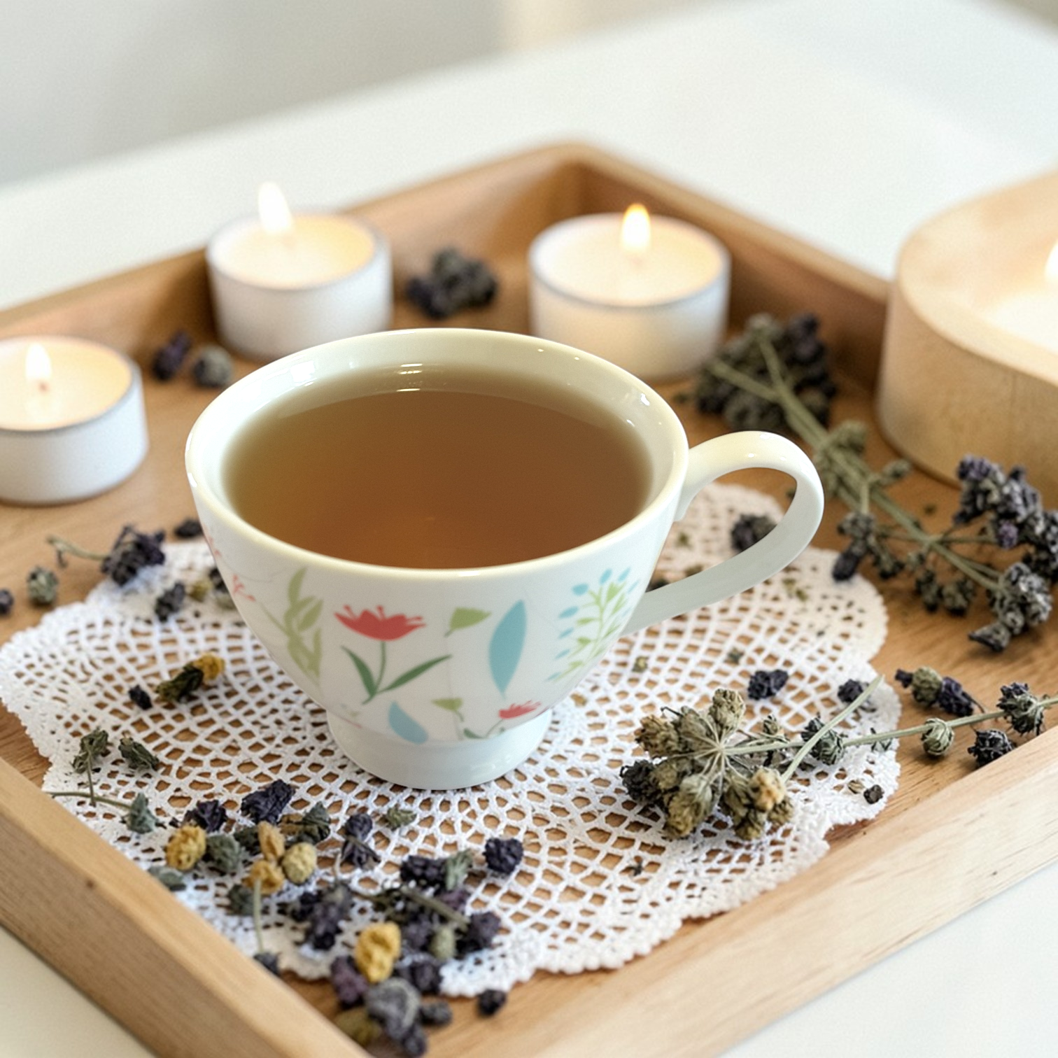 Inner Peace wellness tea on a wooden tray with dried herbs and candles