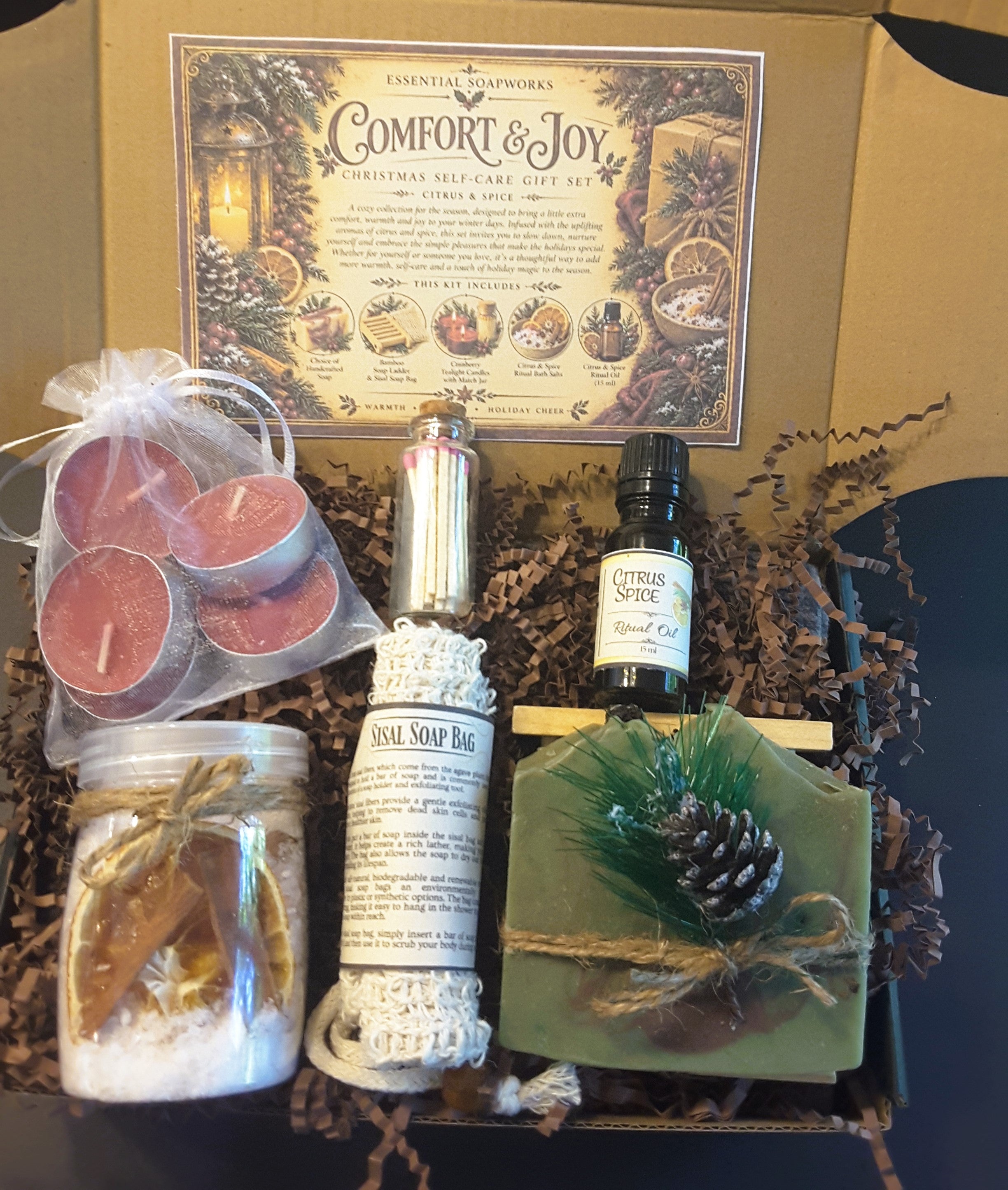 Alpine Frost Comfort & Joy Christmas self-care gift kit by Essential Soapworks featuring handmade soap, bath salts, cranberry candles, ritual oil and natural bathing accessories.