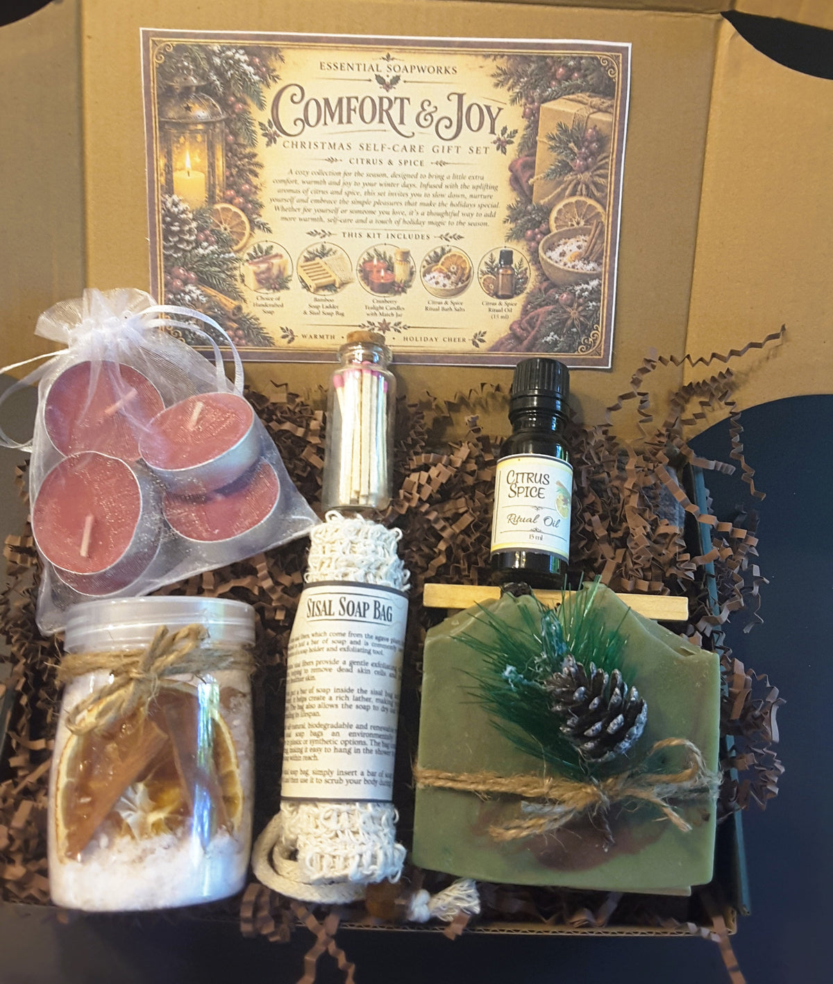 Alpine Frost Comfort & Joy Christmas self-care gift kit by Essential Soapworks featuring handmade soap, bath salts, cranberry candles, ritual oil and natural bathing accessories.