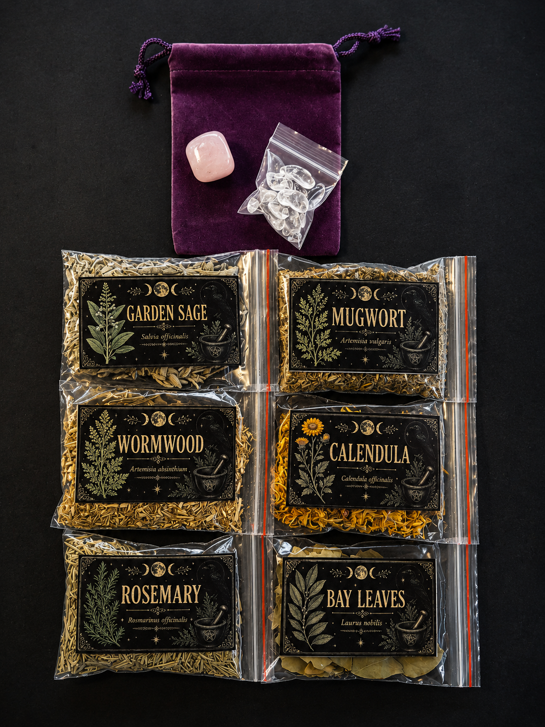 Six clear plastic bags of dried herbs arranged in a 2x3 grid on a black background, with a purple velvet drawstring pouch and a pink crystal above them. The herb labels read Garden Sage, Mugwort, Wormwood, Calendula, Rosemary, and Bay Leaves.