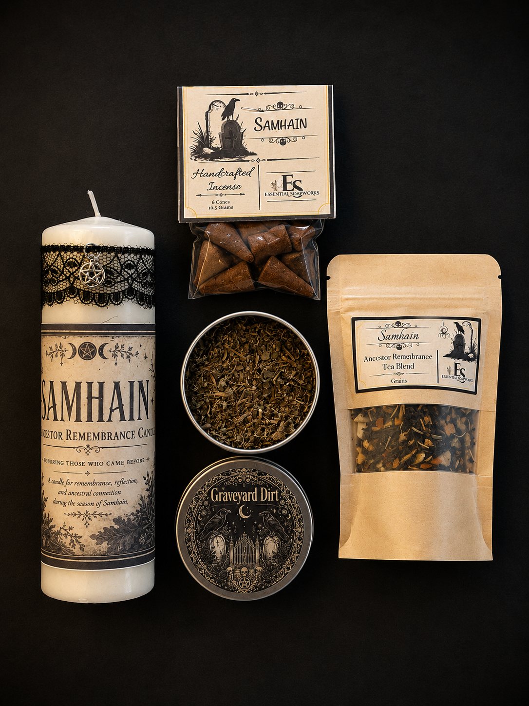 A product flat-lay on a black background featuring a white Samhain candle with a black label, a box of handcrafted incense, a bag of American Broadleaf Tea Blend, a tin of Graveyard Dirt tea blend, and a bowl of incense sticks.