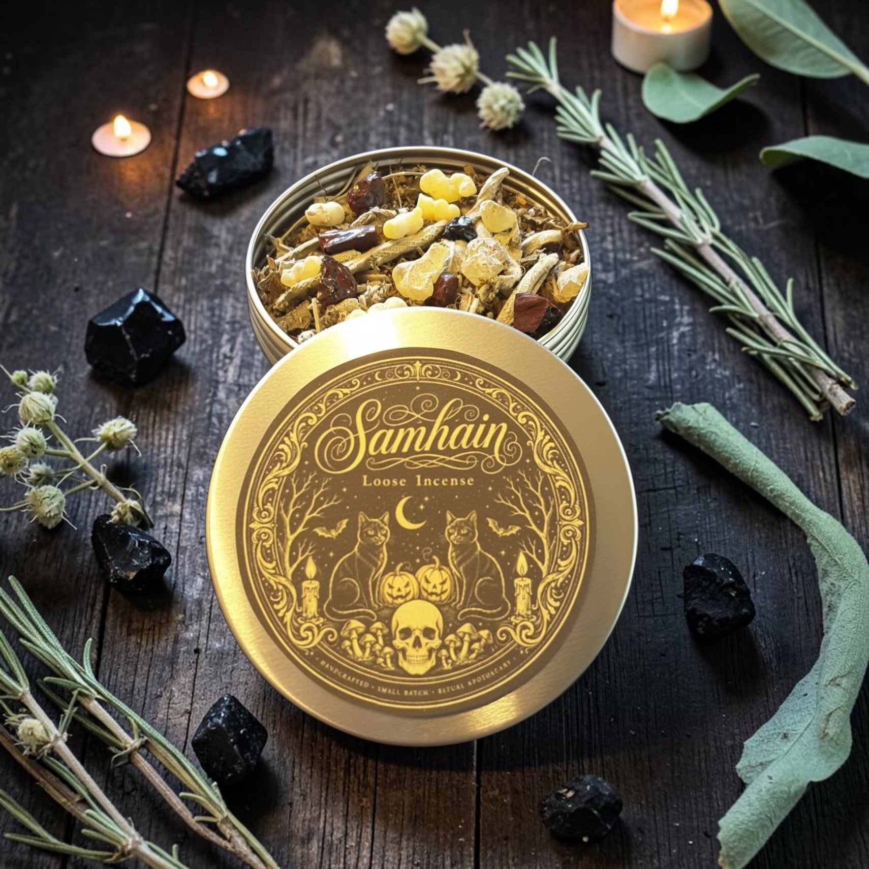 A round metal tin of Samhain Loose Incense shown open on a dark rustic wooden surface, with the lid placed in front. The incense inside contains dried herbs, leaves, and small yellow flower pieces.