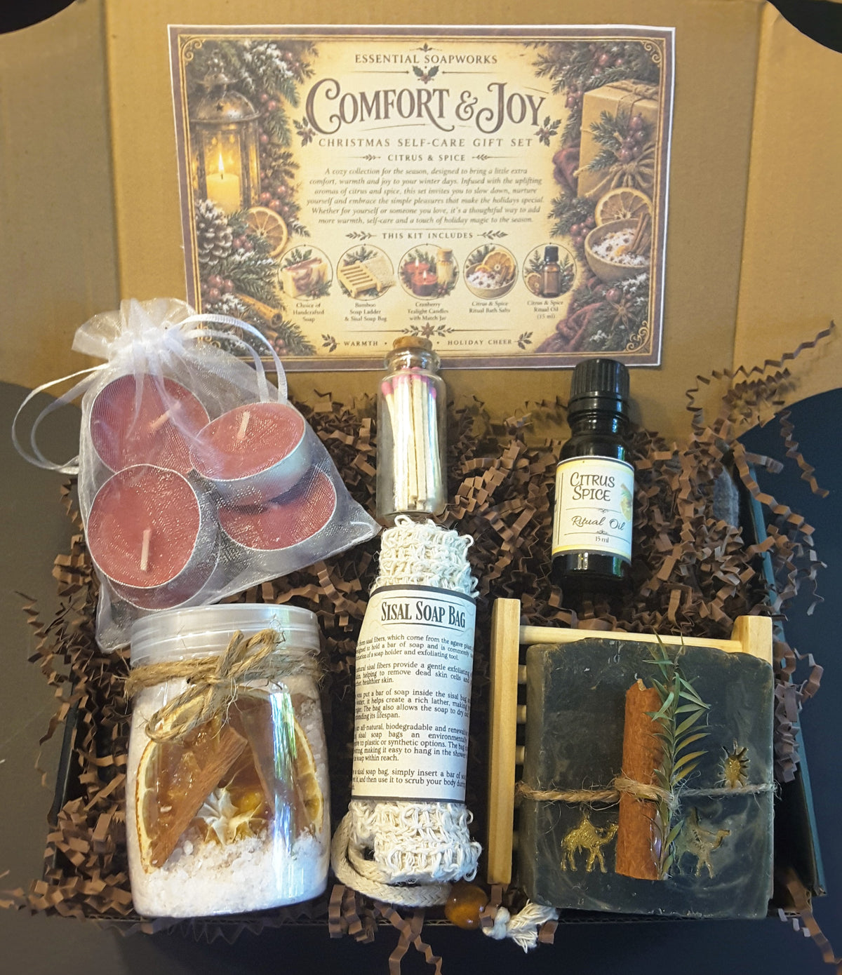 Winter Solstice Comfort & Joy Christmas self-care gift kit by Essential Soapworks featuring handmade soap, bath salts, cranberry candles, ritual oil and natural bathing accessories.