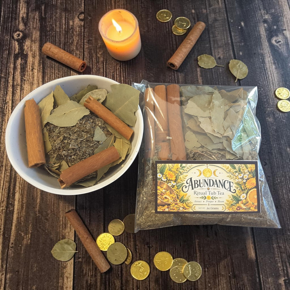abundance tub tea on a dark wooden surface with gold coins, bay leaves, cinnamon sticks and candles
