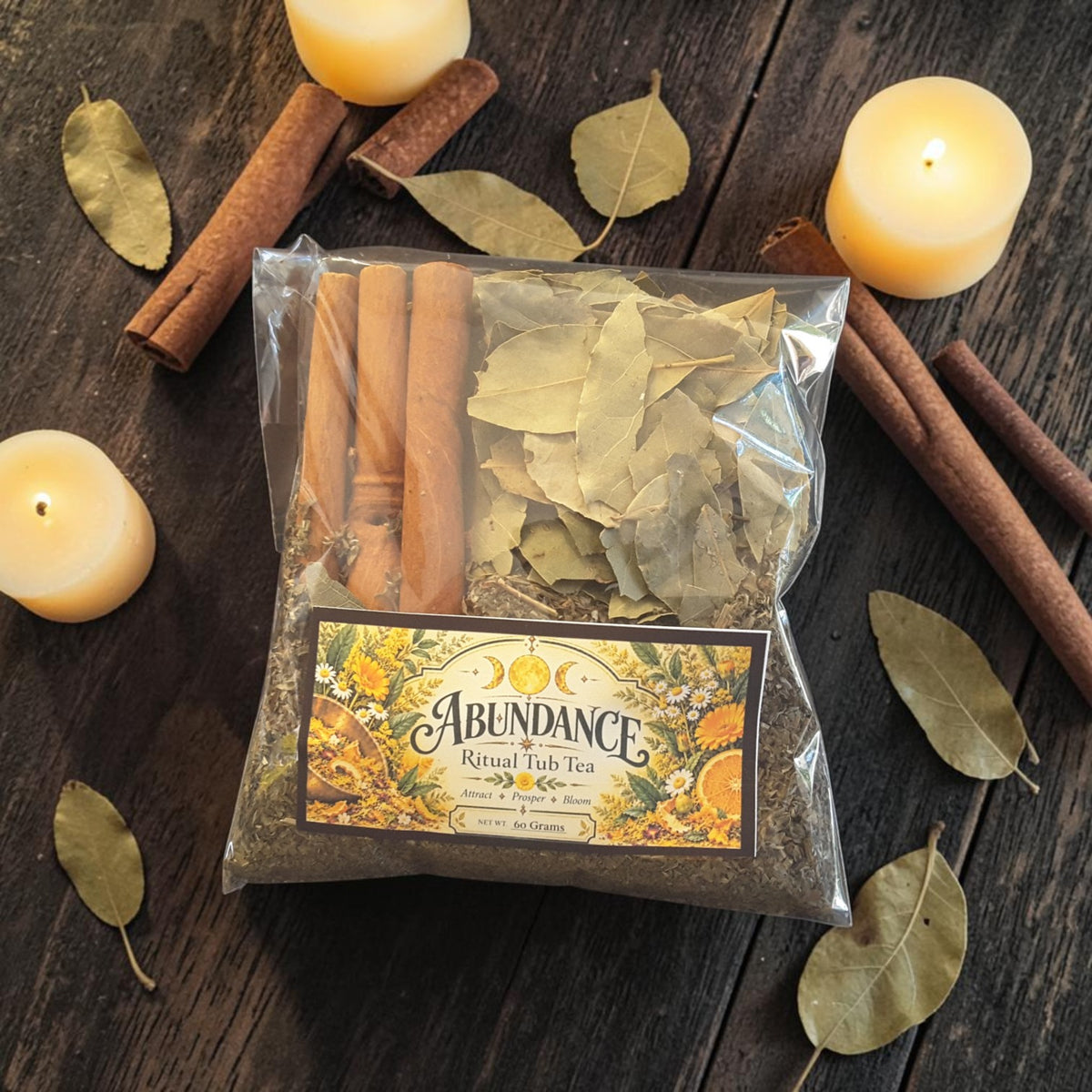 abundance tub tea on a dark wooden surface with bay leaves, cinnamon sticks and candles