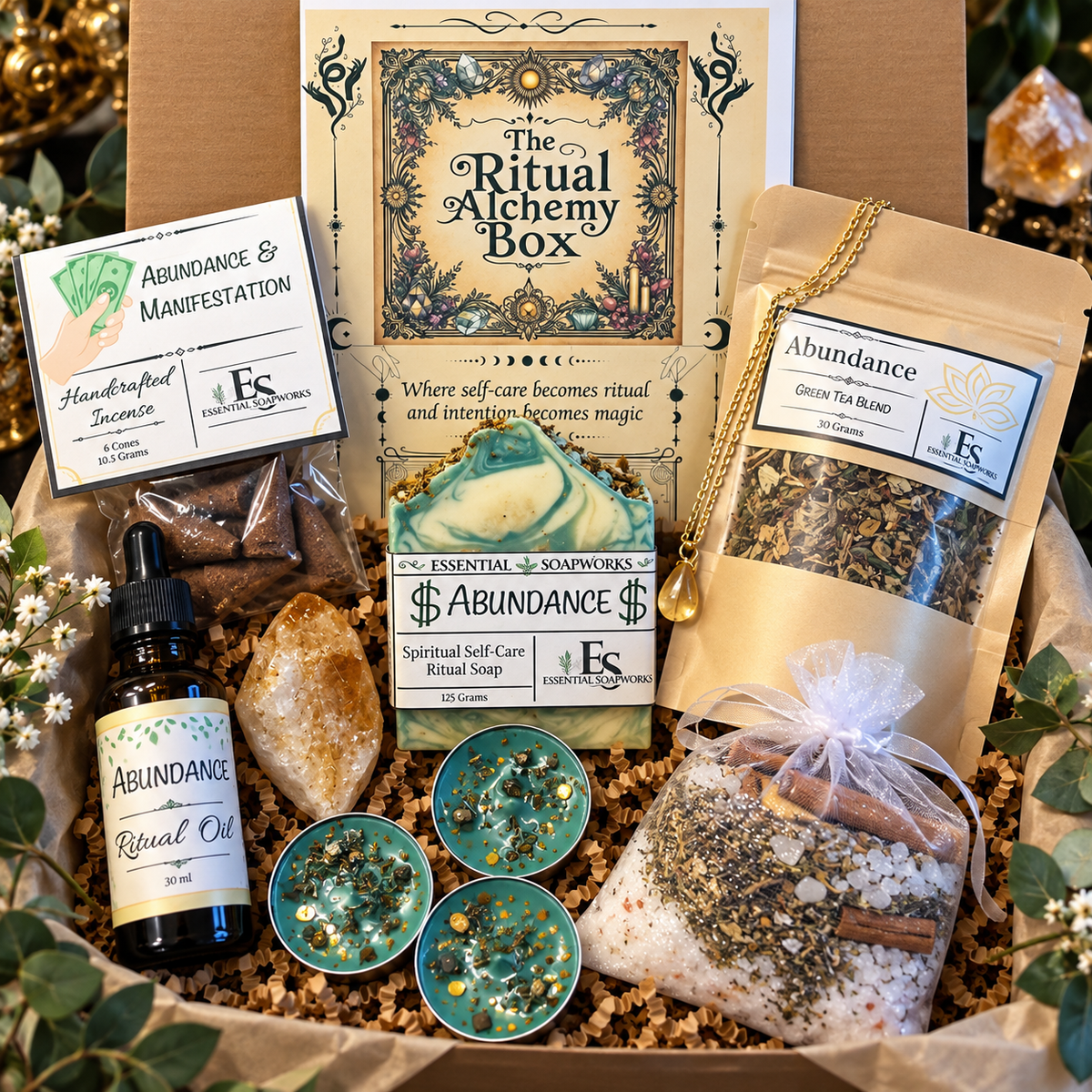 abundance ritual alchemy witchy subscription kit featuring ritual guide, botanical soap, loose leaf tea, ritual oil, incense, candles, crystals and jewelry