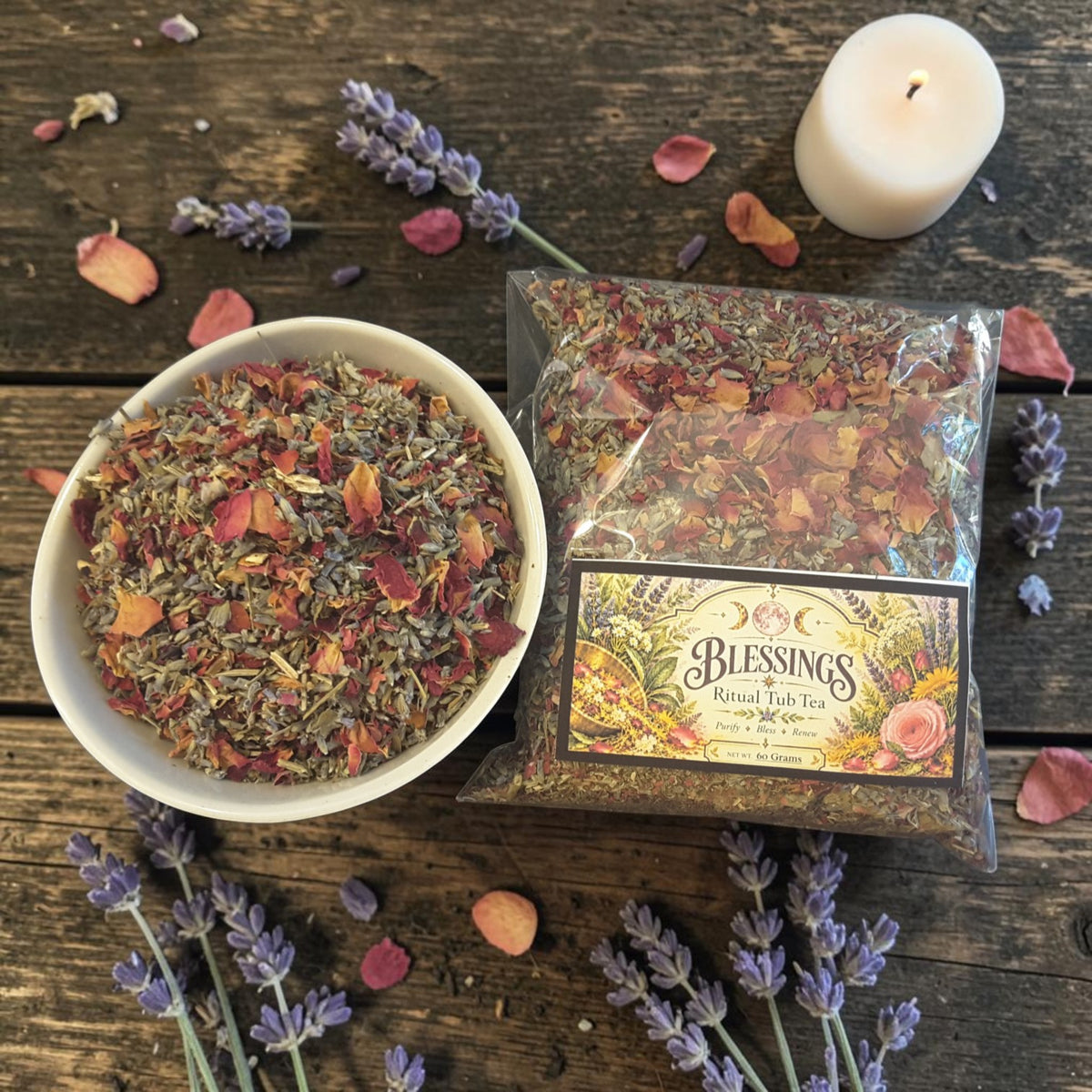 blessings tub tea on a dark wooden surface with rose petals, lavender and candles