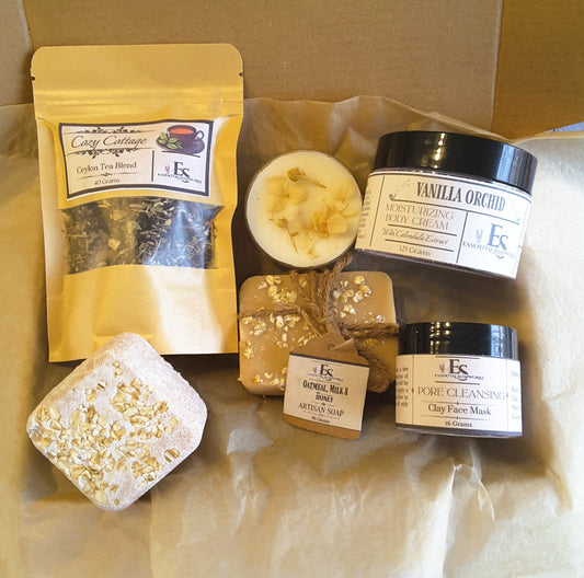 Oatmeal milk and honey self-care kit including cream, soap, and face mask on brown paper.