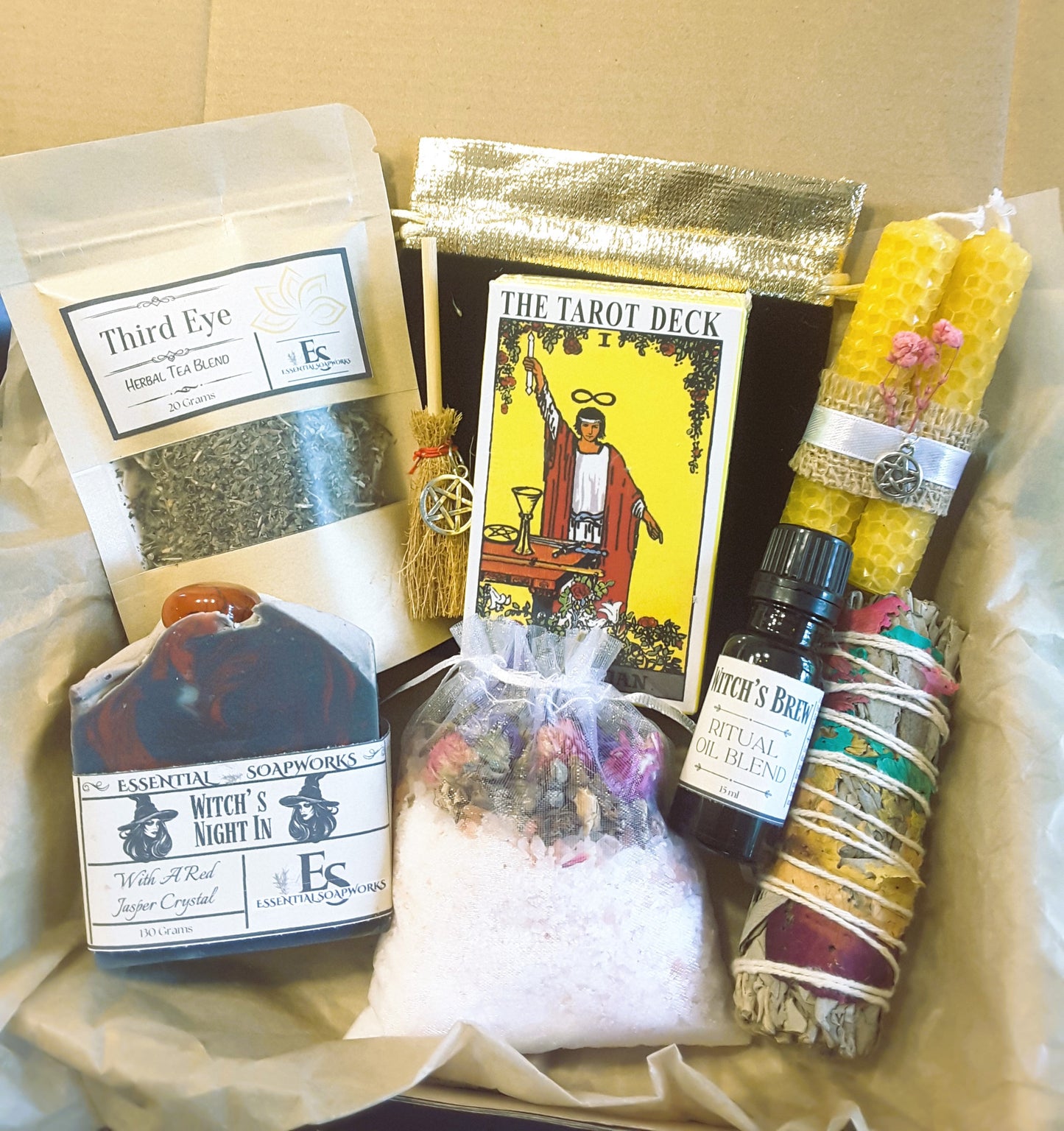 Cozy witch self-care ritual kit with items like tea, tarot cards, and crystals.