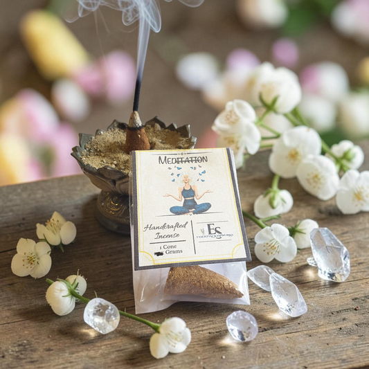 Meditation incense with incense cone, flowers, and crystals on a wooden surface