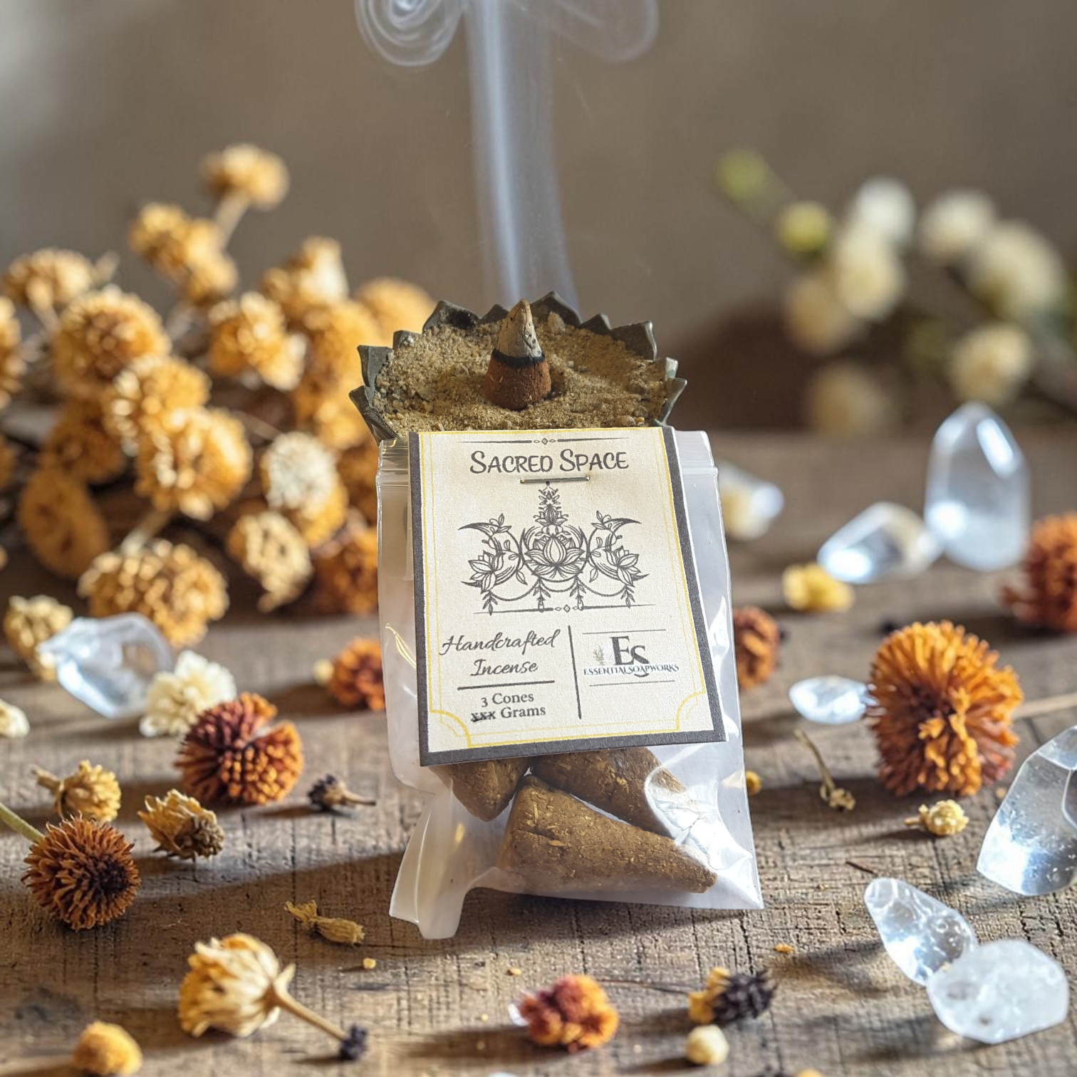 sacred space incense cones on a wooden surface with dried orange flowers