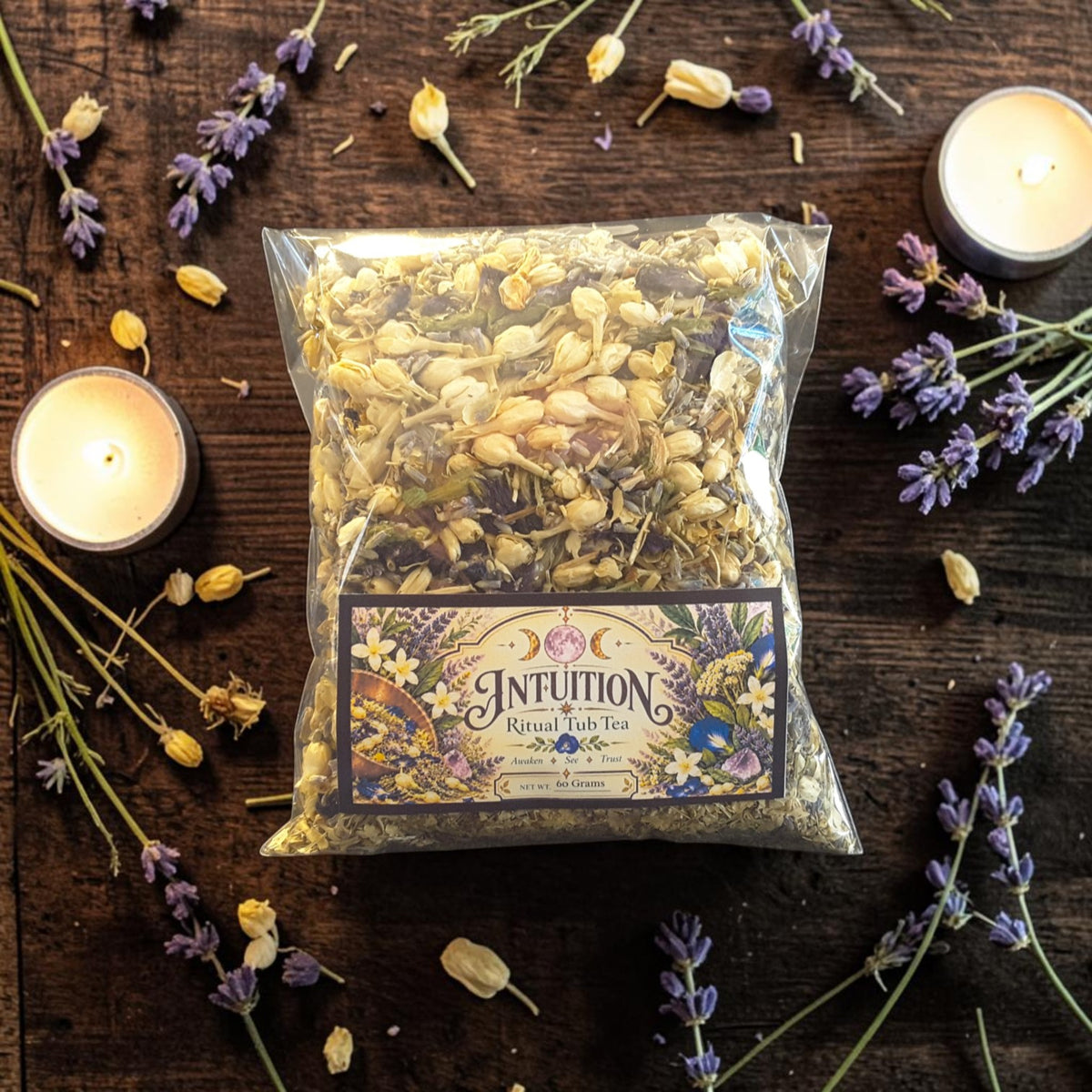 intuition tub tea on a dark wooden surface with jasmine, lavender and candles