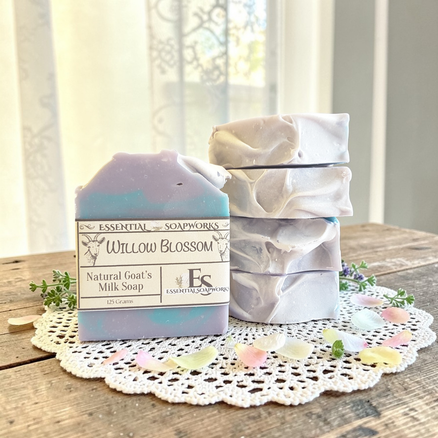 Natural goat milk soap bars on a wooden surface