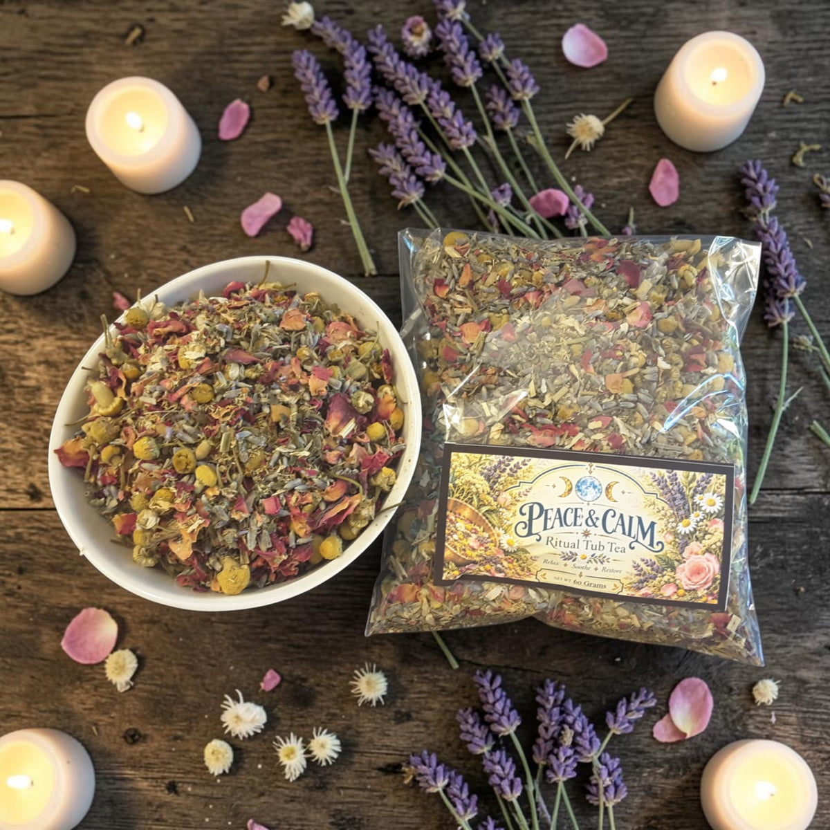 peace and calm herbal tub tea on a wooden surface with candles, lavender and red rose petals