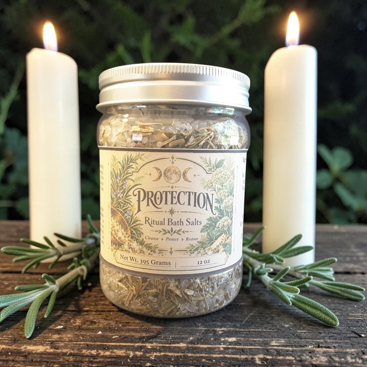 protection herbal bath salts in a jar on a dark wooden surface with rosemary and candles