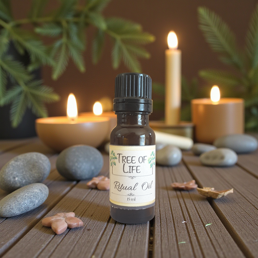 Bottle of 'Tree of Life' ritual oil on a wooden surface with candles and stones in the background