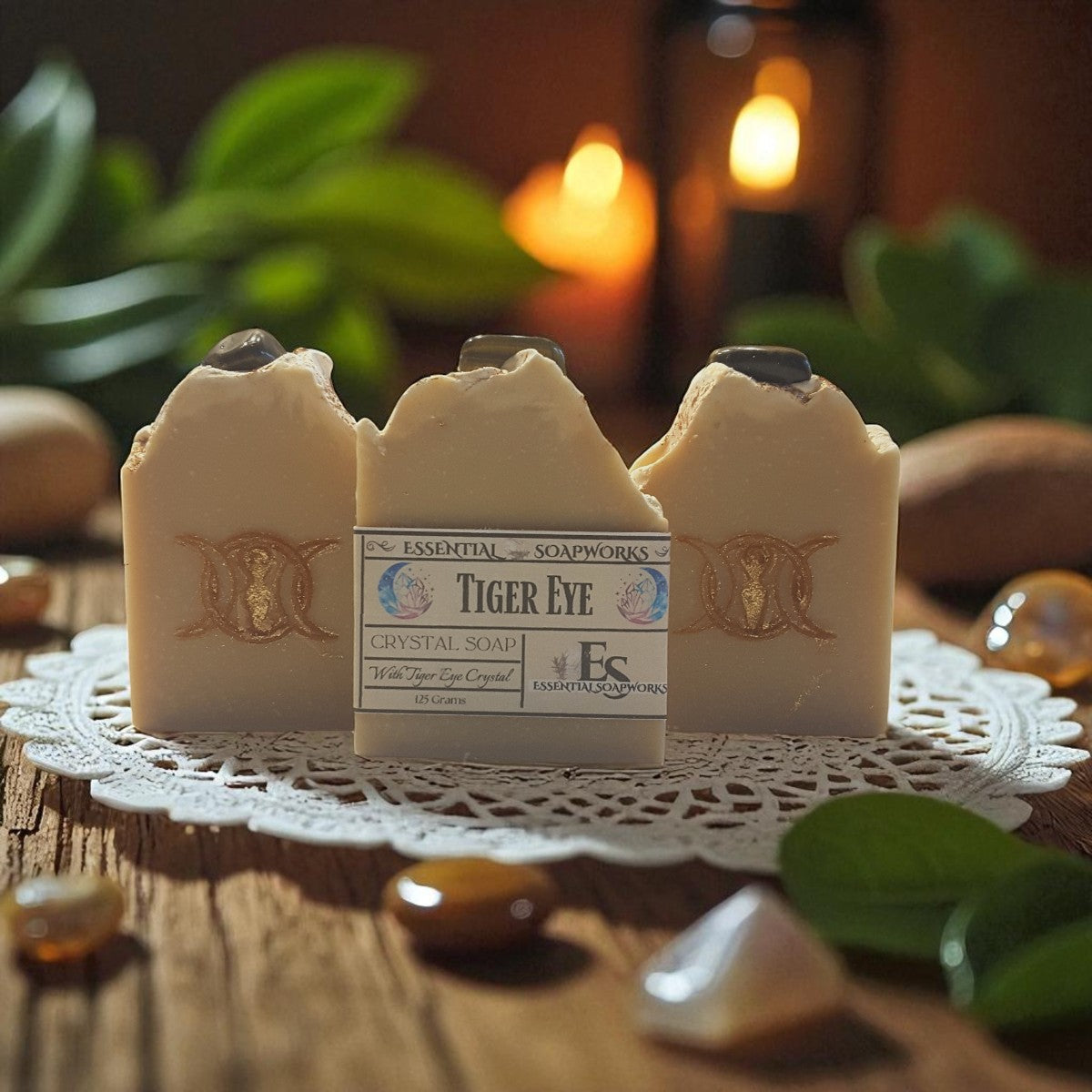 three bars of tiger eye crystal soap with a triple goddess symbol