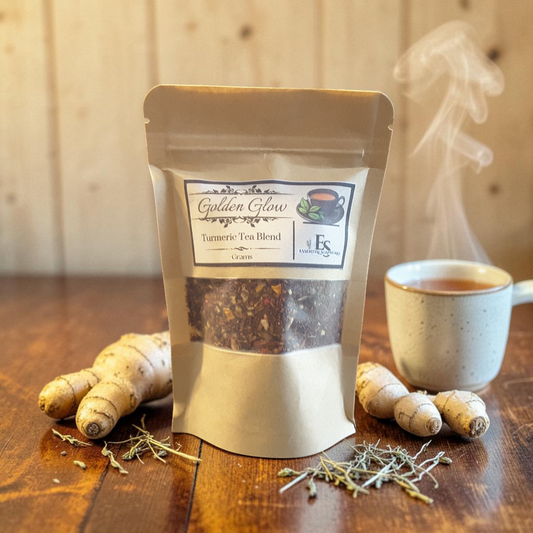 turmeric tea on a wooden surface with a teacup and turmeric root